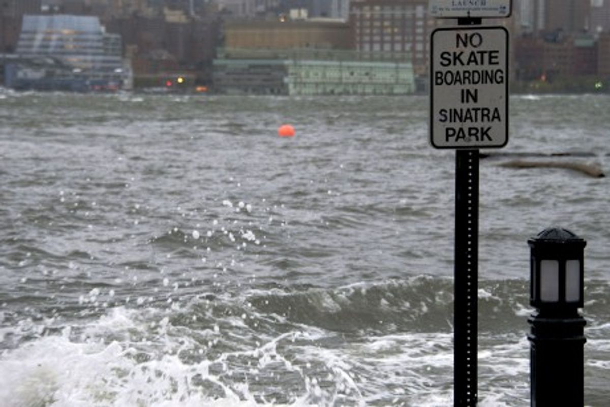 The Hudson River swells and rises over the banks of the Hoboken, N.J., waterfront as Hurricane Sandy approaches on Monday (AP Photo/Charles Sykes)        