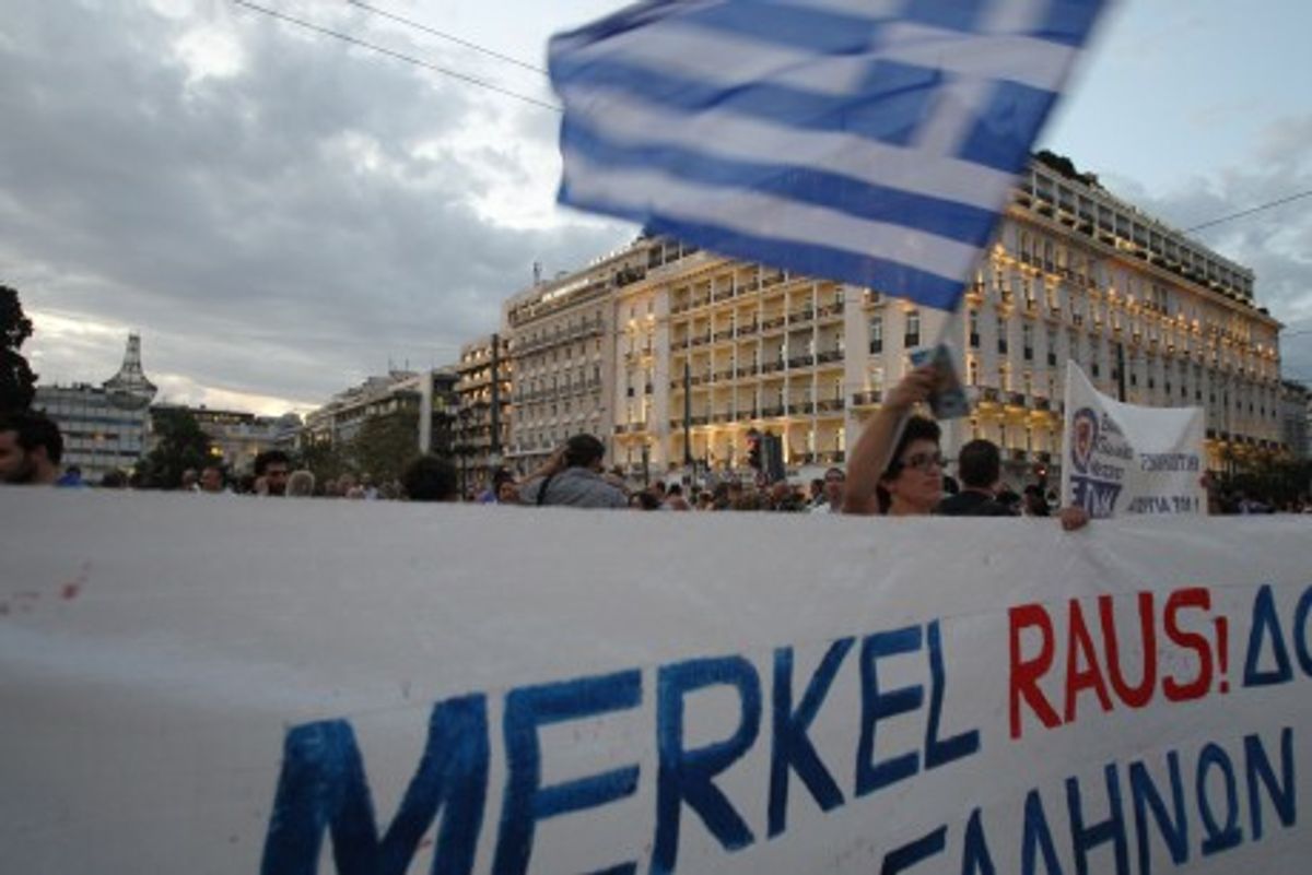 Banner in Athens says "Merkel leave" (AP/Thanassis Stavrakis)