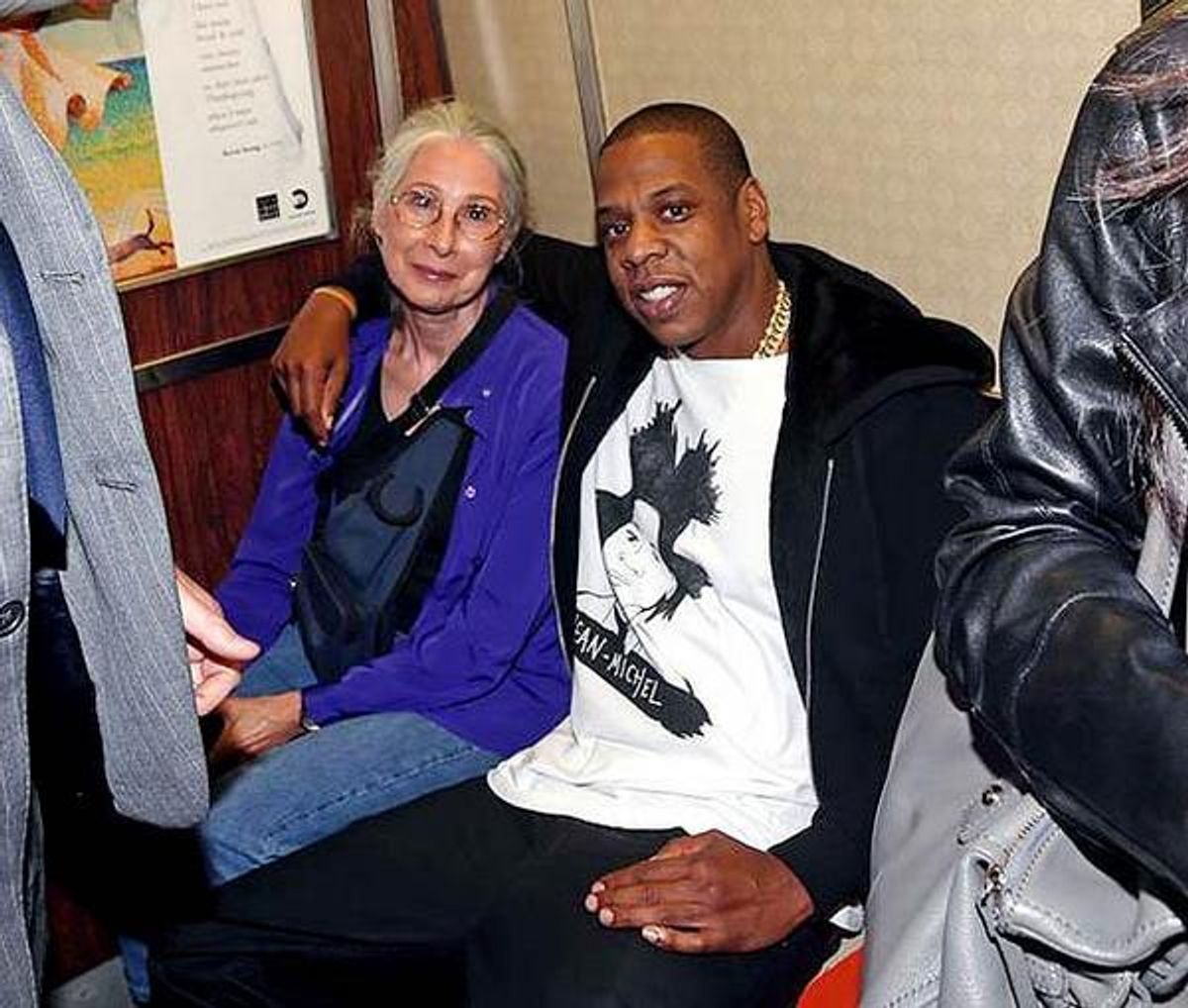  Jay-Z poses with a woman on the R train before Saturday night's performance  (Lawrence Scwartzwald/Splash News)