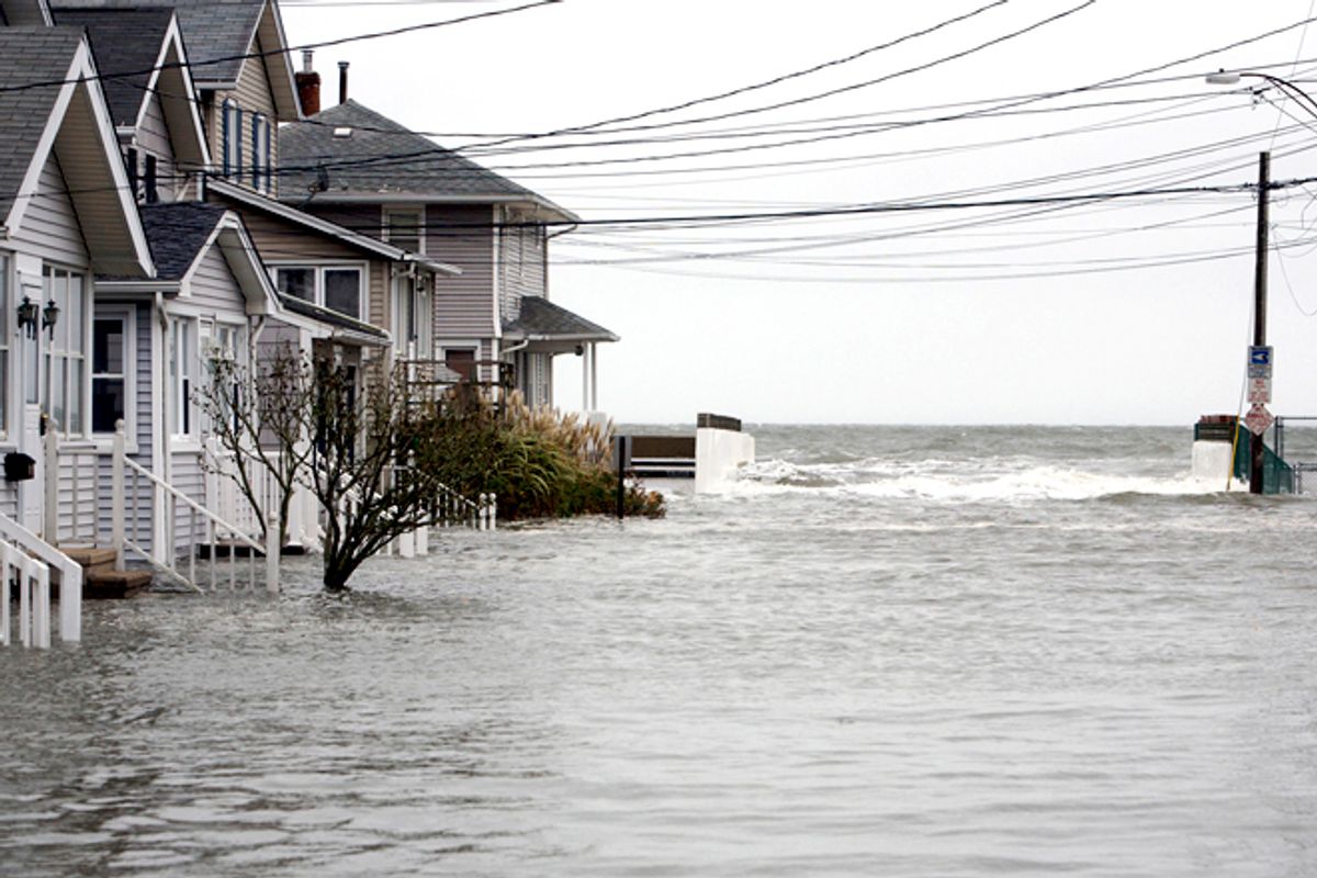 High tide begins to flood a street on the shoreline area of Milford, Conn., as Hurricane Sandy approaches Oct. 29, 2012.      (Reuters/Michelle Mcloughlin)