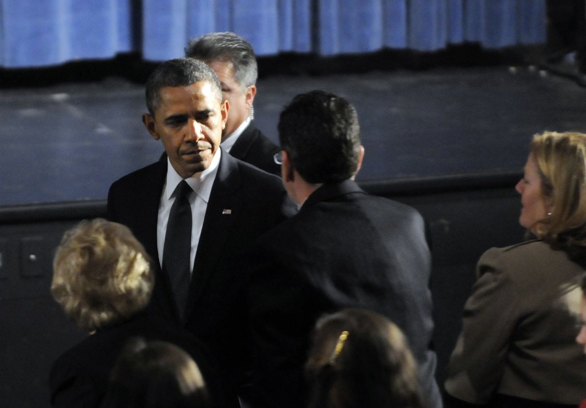 President Barack Obama greets Gov. Dannel Malloy during his arrival at the start of an interfaith vigil for the victims of the Sandy Hook Elementary School shooting.              (AP/The Hartford Courant, Stephen Dunn, Pool)