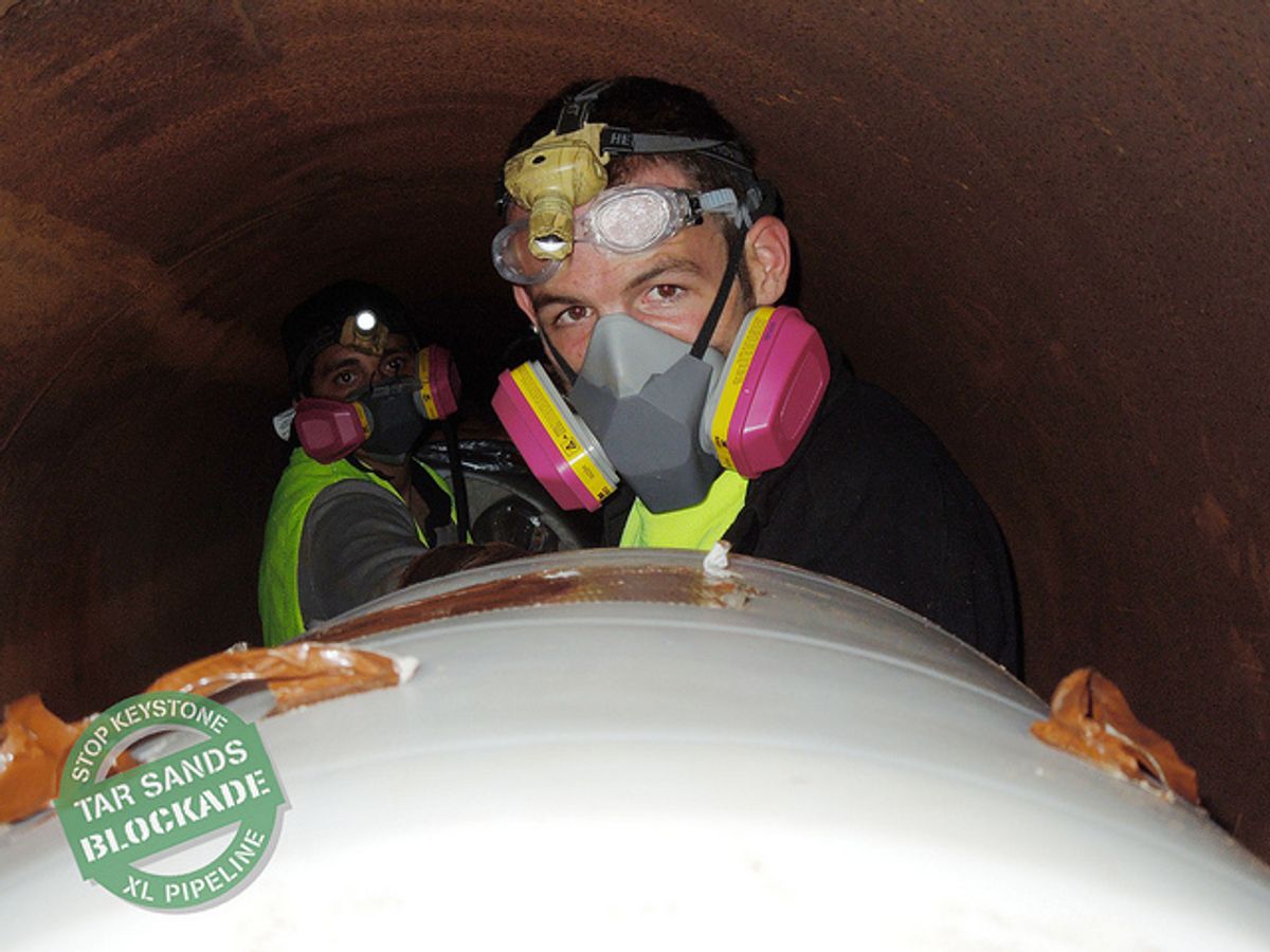 Glen Collins wore a gas mask inside the pipeline (via tarsandsblockade.org) 