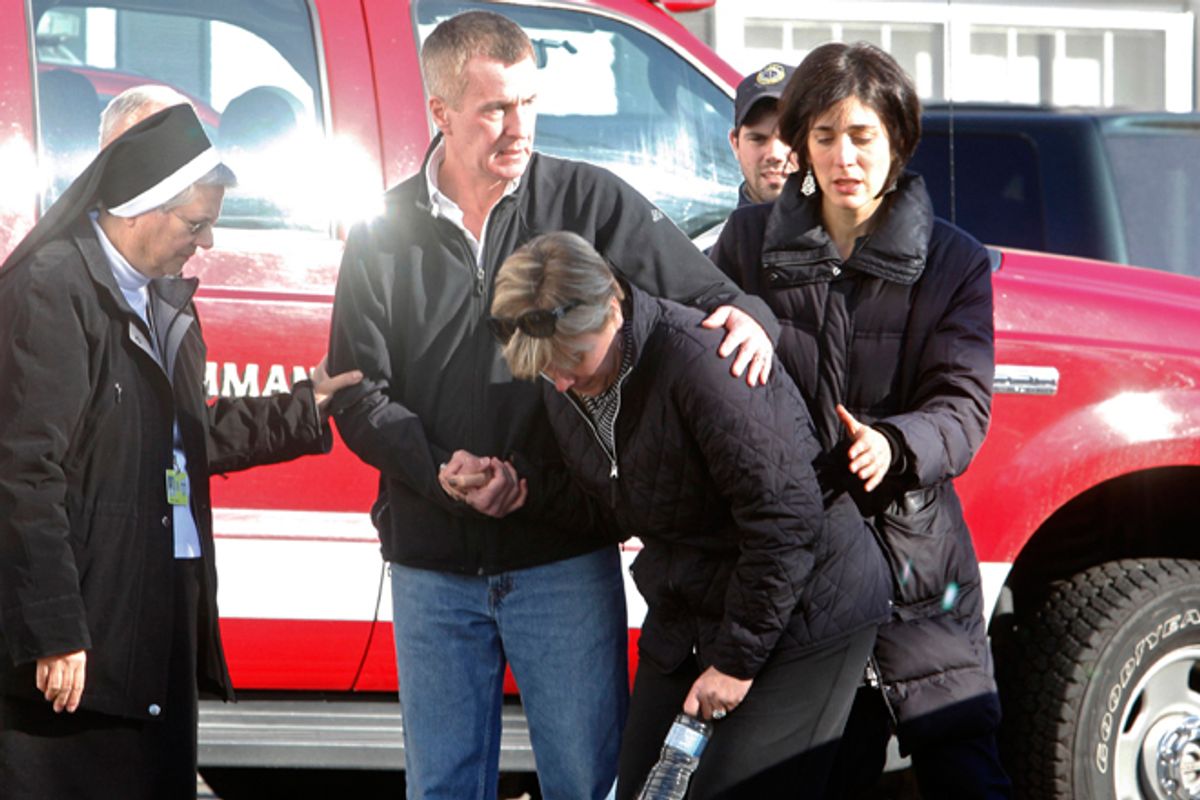 Relatives react outside Sandy Hook Elementary School following a shooting in Newtown, Connecticut, December 14, 2012.                       (Reuters/Michelle Mcloughlin)