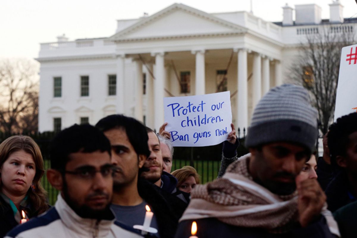 Supporters of gun control gather on Pennsylvania Avenue in front of the White House in Washington, Friday, Dec. 14, 2012, during a vigil for the victims of the shooting at Sandy Hook Elementary School in Newtown, CT.     (AP/Charles Dharapak)