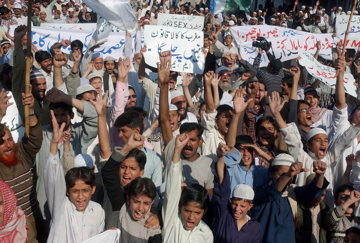 Supporters of a radical Islamist coalition chant anti-government slogans during a rally.      (AP/Shakil Adil)