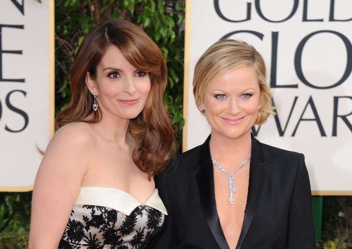 Show hosts Tina Fey, left, and Amy Poehler arrive at the 70th Annual Golden Globe Awards at the Beverly Hilton Hotel on Sunday Jan. 13, 2013, in Beverly Hills, Calif. (Photo by Jordan Strauss/Invision/AP)         (Jordan Strauss/invision/ap)