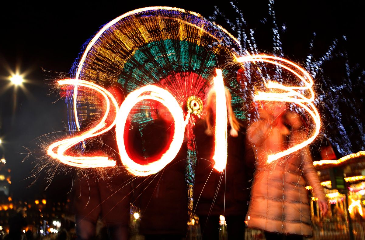 Revellers write the number 2013 using sparklers during the Hogmanay (New Year) street party celebrations in Edinburgh, Scotland         (David Moir/Reuters)