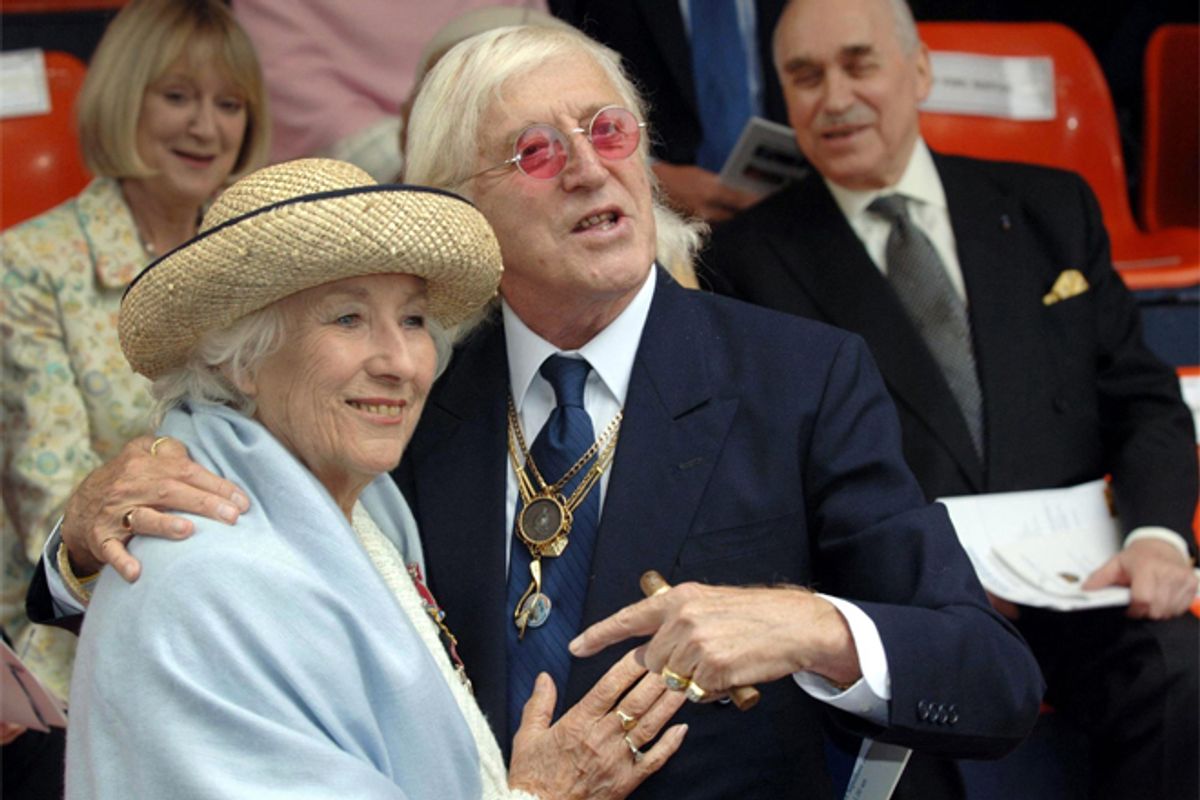 Jimmy Savile and British singer Vera Lynne at the unveiling of a
contemporary sculpture at Victoria Embankment in central London, Sept.
18, 2005.    (Matthew Fearn)