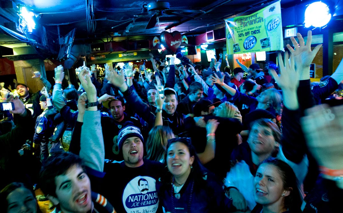 Baltimore Ravens fans celebrate at a pub in Baltimore after the Ravens won the NFL football Super Bowl against the San Francisco 49ers, Sunday, Feb. 3, 2013.      (AP/Jose Luis Magana)