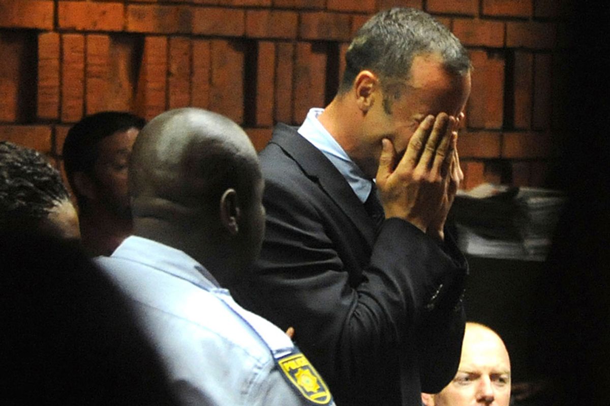 Olympic sprinter Oscar Pistorius weeps in court during his bail hearing in the murder case of Reeva Steenkamp. Pistorius allegedly shot his girlfriend on Valentine's Day.          (AP/Antione de Ras)