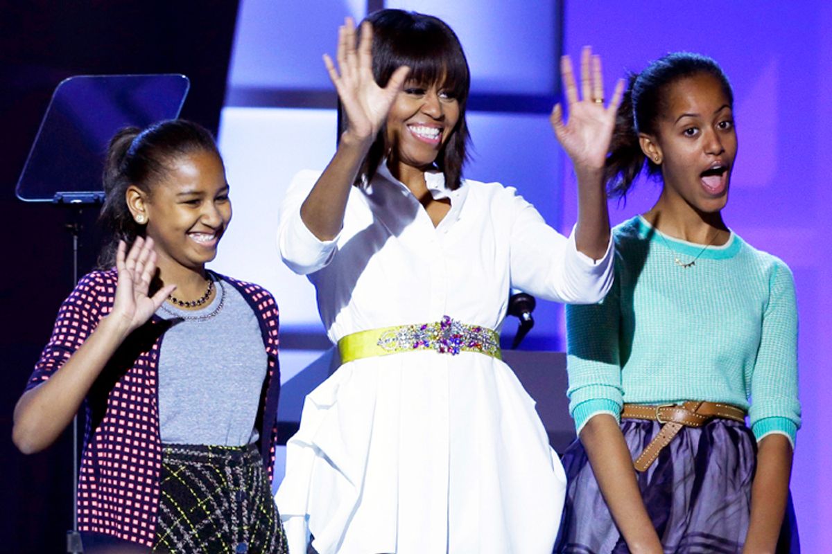 First lady Michelle Obama, center, and daughters Sasha, left, and Malia, right. (AP/Frank Franklin Ii)