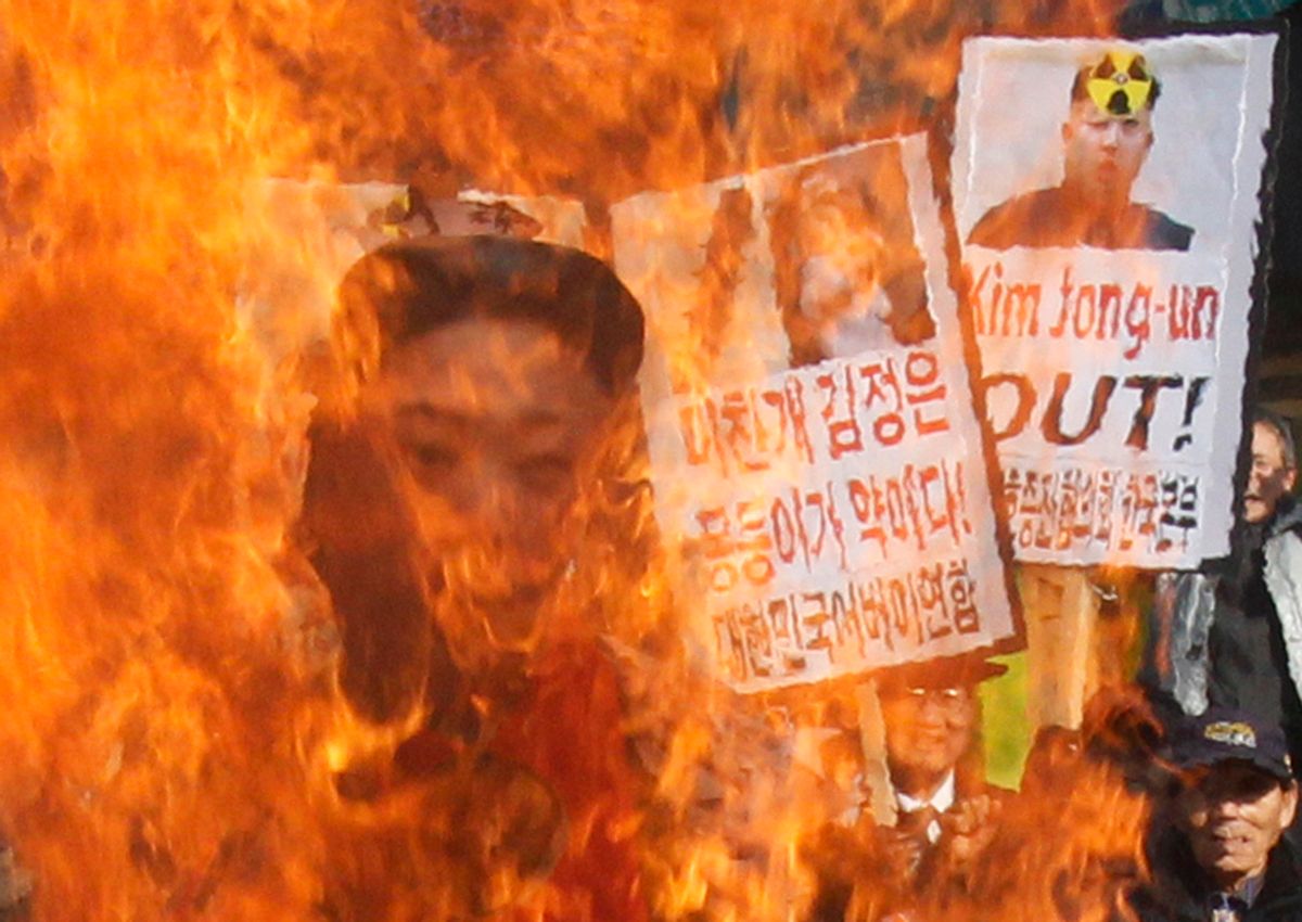 South Korean protesters burn an effigy of North Korean leader Kim Jong Un during an anti-North Korea rally to denounce North Korea's nuclear test  in Seoul, South Korea.          (AP/Ahn Young-joon)