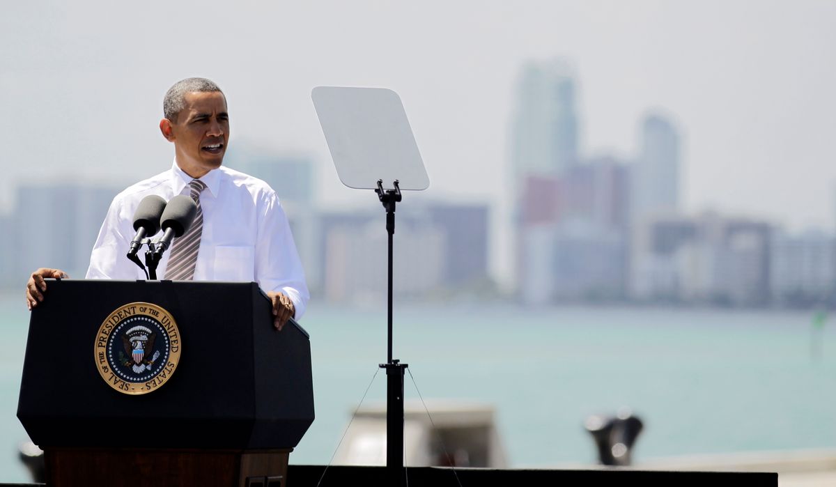 President Barack Obama speaks at a port in Miami, Friday, March 29, 2013, promoting a plan to create construction and other jobs by attracting private investment in roads and other public works projects.            (AP/Luis M. Alvarez)