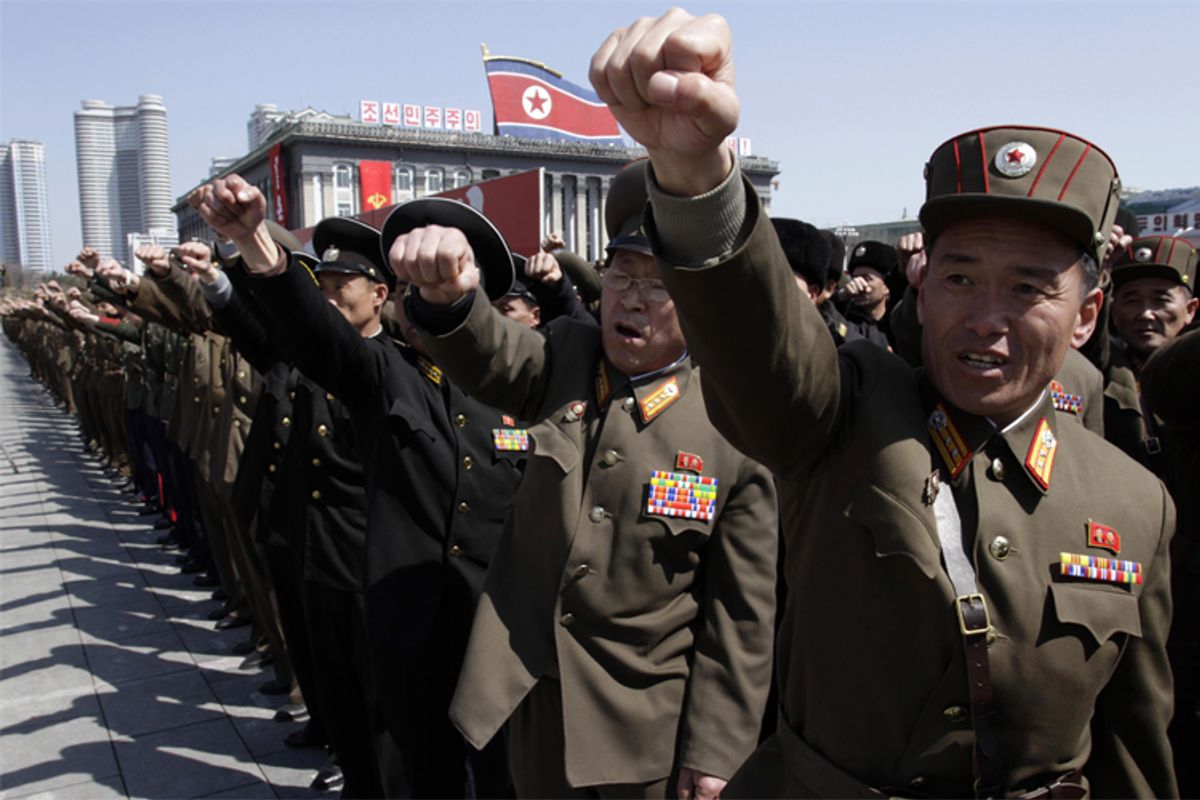 North Korean army officers punch the air as they chant slogans during a rally at Kim Il Sung Square in downtown Pyongyang, North Korea, Friday, March 29, 2013. Tens of thousands of North Koreans turned out for the mass rally at the main square in Pyongyang in support of their leader Kim Jong Un's call to arms. (AP Photo/Jon Chol Jin)         (Jon Chol Jin)