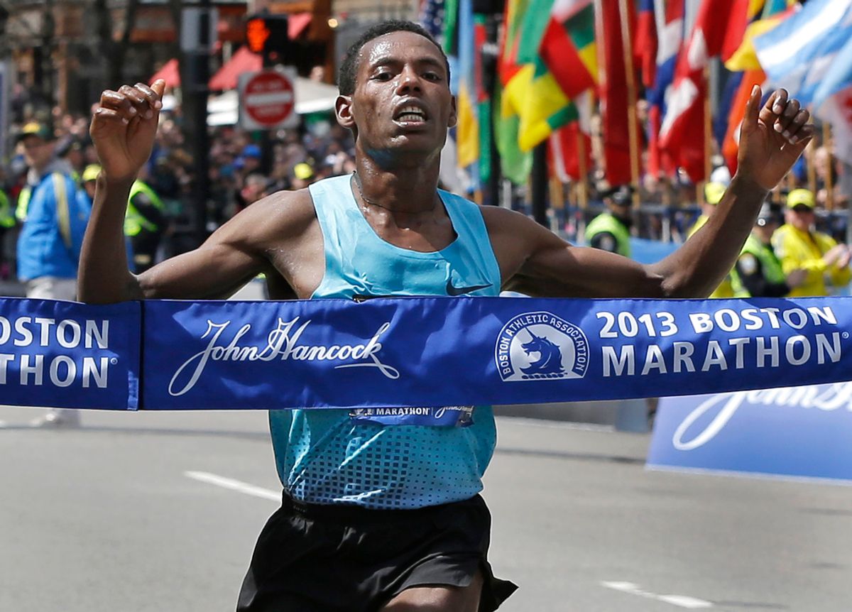 Lelisa Desisa of Ethiopia crosses the finish line to win the men's division of the 2013 Boston Marathon in Boston Monday, April 15, 2013.   (AP/Elise Amendola)