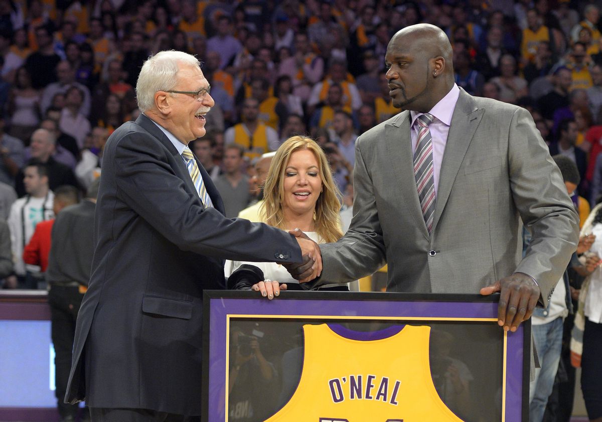 Former Los Angeles Lakers center Shaquille O'Neal, right, shakes hands with former Lakers head coach Phil Jackson     (AP/Mark J. Terrill)
