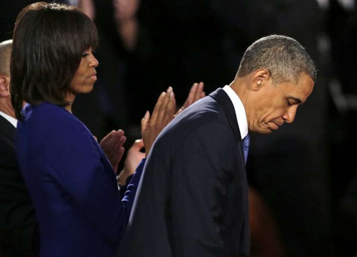 President Barack Obama, accompanied by first lady Michelle Obama in Boston, Thursday, April 18, 2013.  (AP/Charles Krupa)