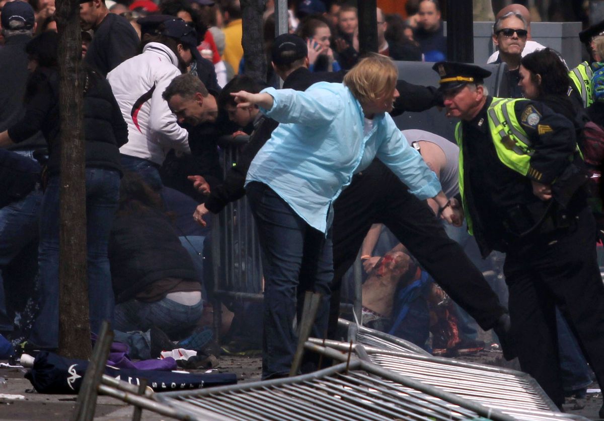 People react to an explosion at the 2013 Boston Marathon in Boston, Monday, April 15, 2013.          (AP/The Daily Free Press, Kenshin Okubo)