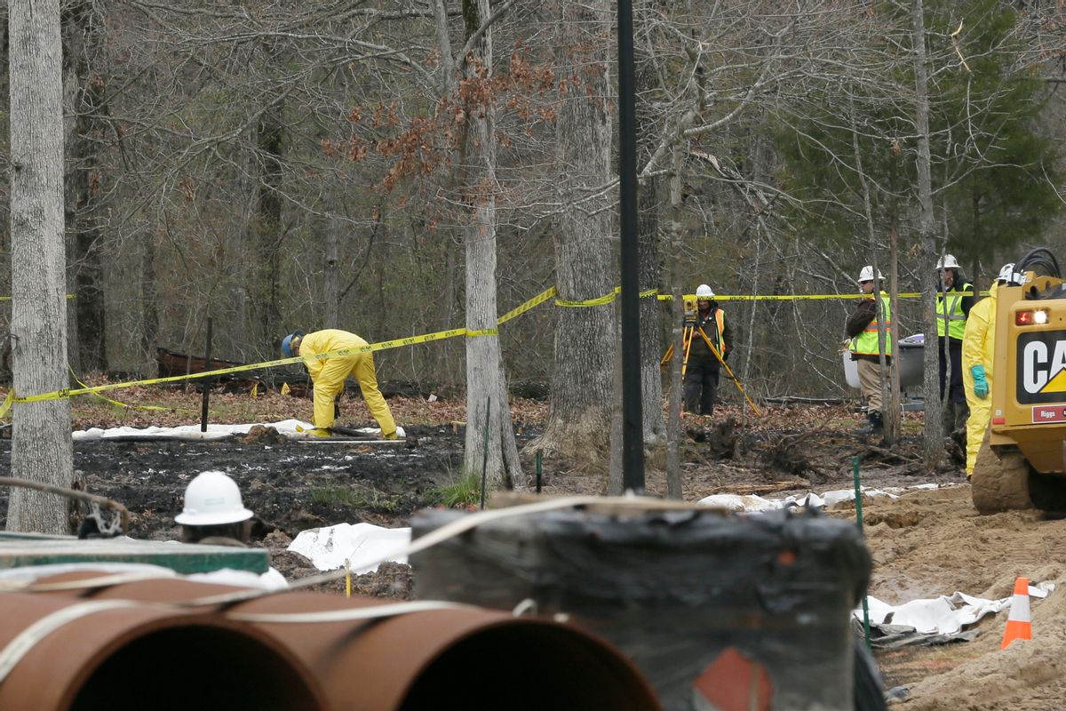Crews work to clean up from an oil pipeline spill in a Mayflower, Ark., neighborhood.                   (AP/Danny Johnston)