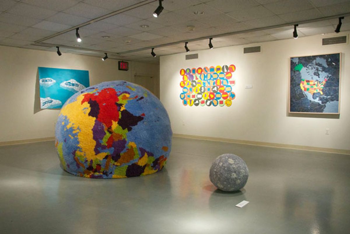 Installation view, “Contemporary Cartographies” at Lehmann College Art Gallery, with Charley Friedman’s “Carpet World/Carpet Moon” in the center (all photos by the author for Hyperallergic) 