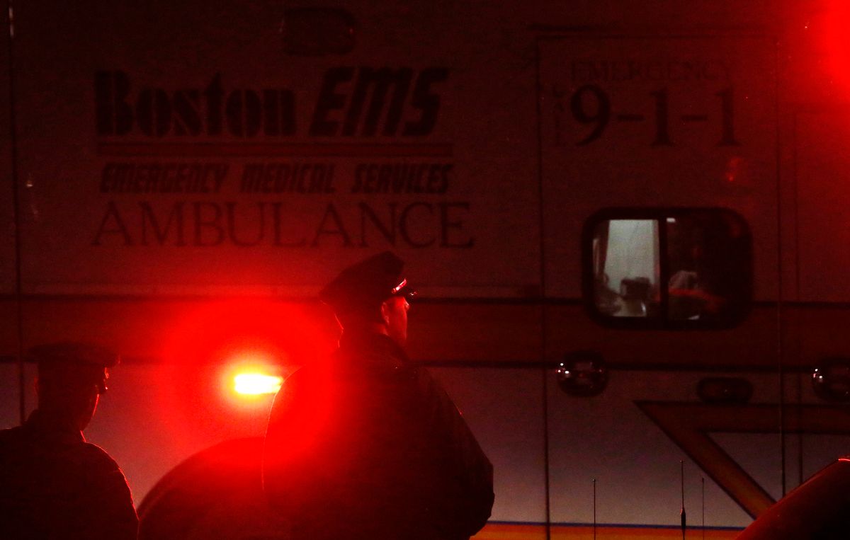 Police watch as an ambulance leaves Franklin Street at the end of the search for Dzhokhar Tsarnaev, the surviving suspect in the Boston Marathon bombings, in Watertown, Mass. on Friday.       (Reuters)