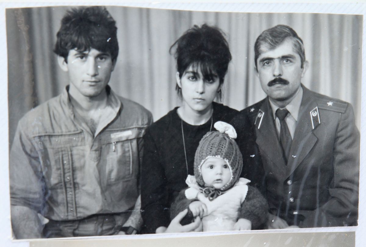A photo, showing Tamerlan (C, bottom) Tsarnaev, accompanied by his father Anzor (L), mother Zubeidat and uncle Muhamad Suleimanov (R), is seen in this photo courtesy of the Suleimanova family in Makhachkala, April 22, 2013.                                     (Reuters)