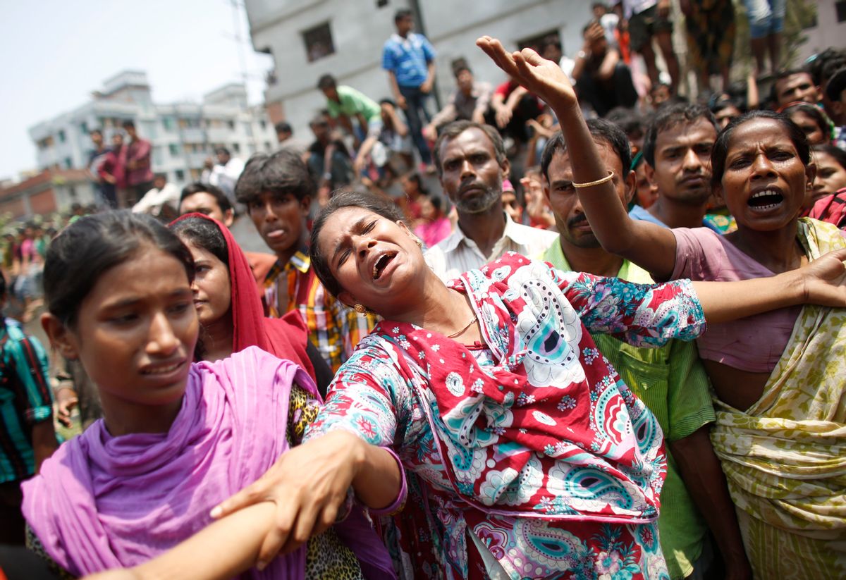 People mourn for their relatives, who were working in the Rana Plaza building when it collapsed, in Savar, 30 km (19 miles) outside Dhaka April 24, 2013.      (Reuters/Andrew Biraj)