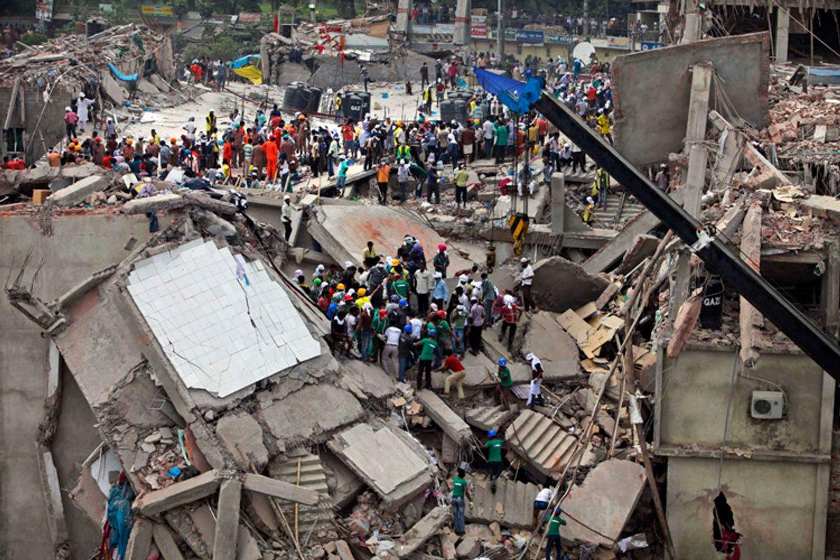 Bangladeshi rescuers work at the site of a building that collapsed Wednesday in Savar, near Dhaka, Bangladesh, Thursday, April 25, 2013.        (AP/A.M. Ahad)