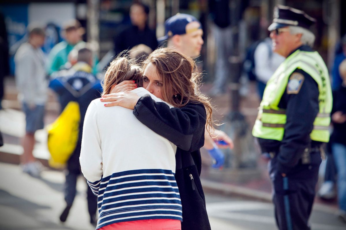 A woman comforts another, after explosions interrupted the 117th Boston Marathon in Boston, Massachusetts April 15, 2013.       (Reuters/Dominick Reuter)