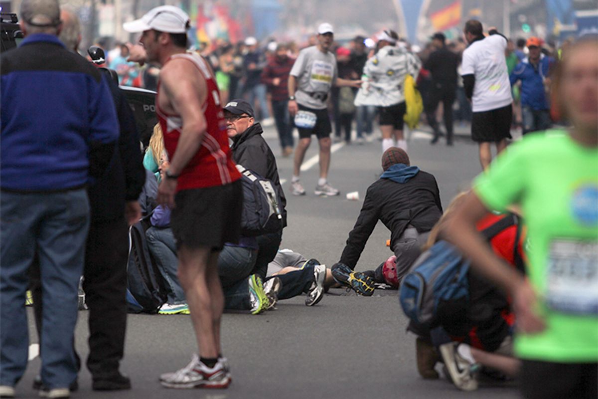 People react to an explosion at the 2013 Boston Marathon in Boston, Monday, April 15, 2013.    (AP/The Daily Free Press/Kenshin Okubo)