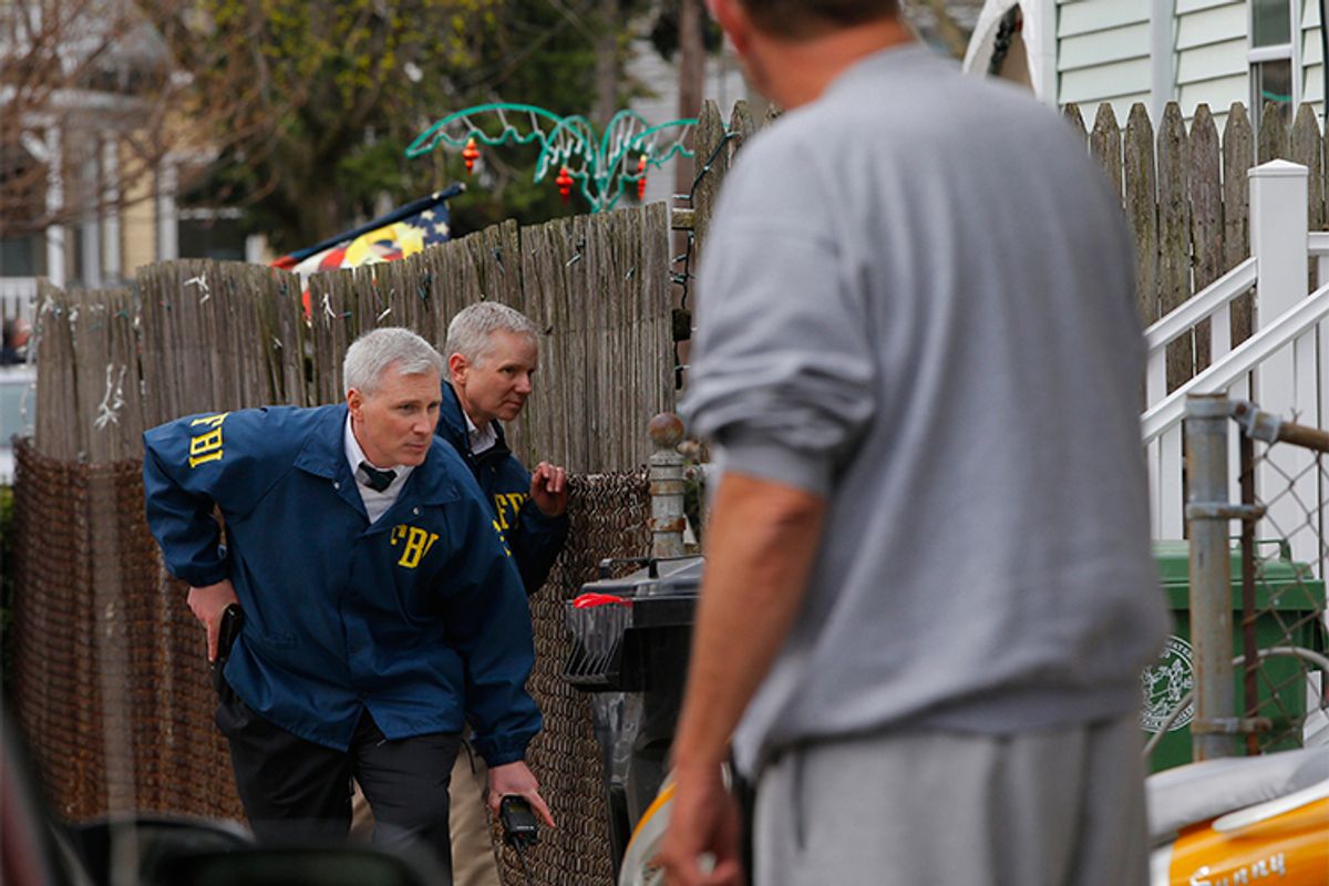 FBI agents search homes for the Boston Marathon bombing suspects in Watertown, Massachusetts April 19, 2013.            (Brian Snyder / Reuters)