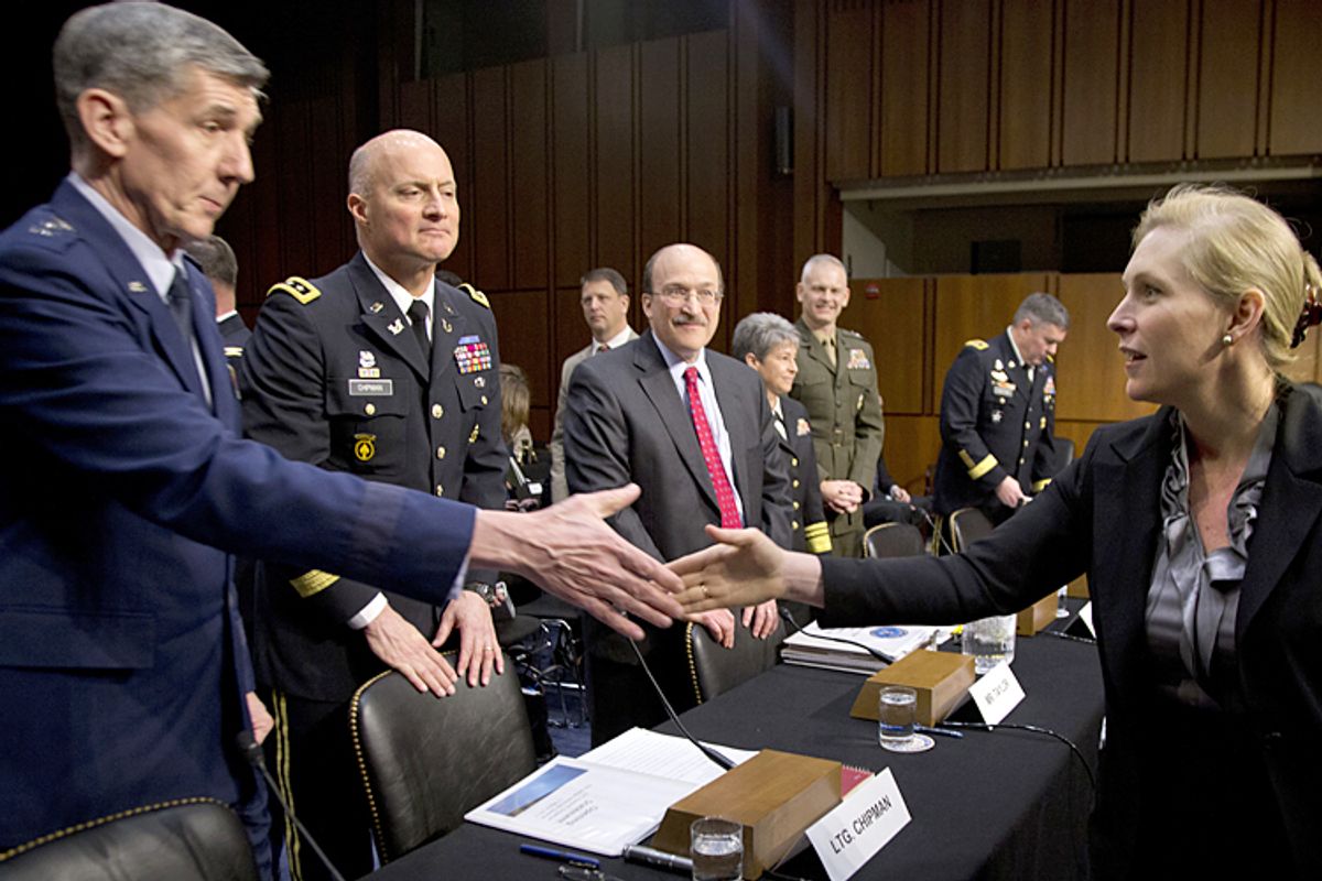 Sen. Kirsten Gillibrand shakes hands with Lt. Gen. Richard Harding, judge advocate general of the Air Force, March 13, 2013.            (AP/Carolyn Kaster)