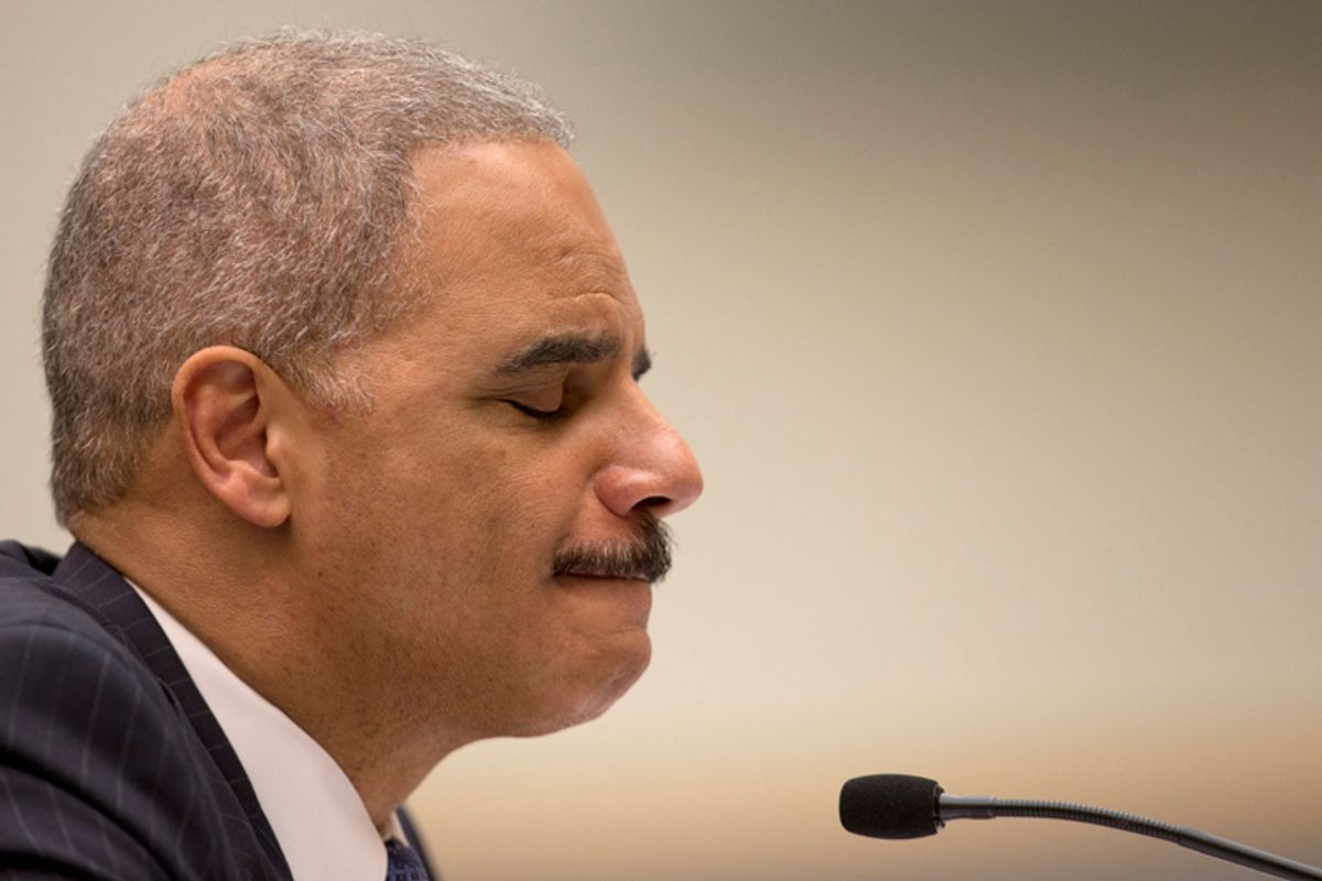 Attorney General Eric Holder pauses as he testifies on Capitol Hill          (Carolyn Kaster)