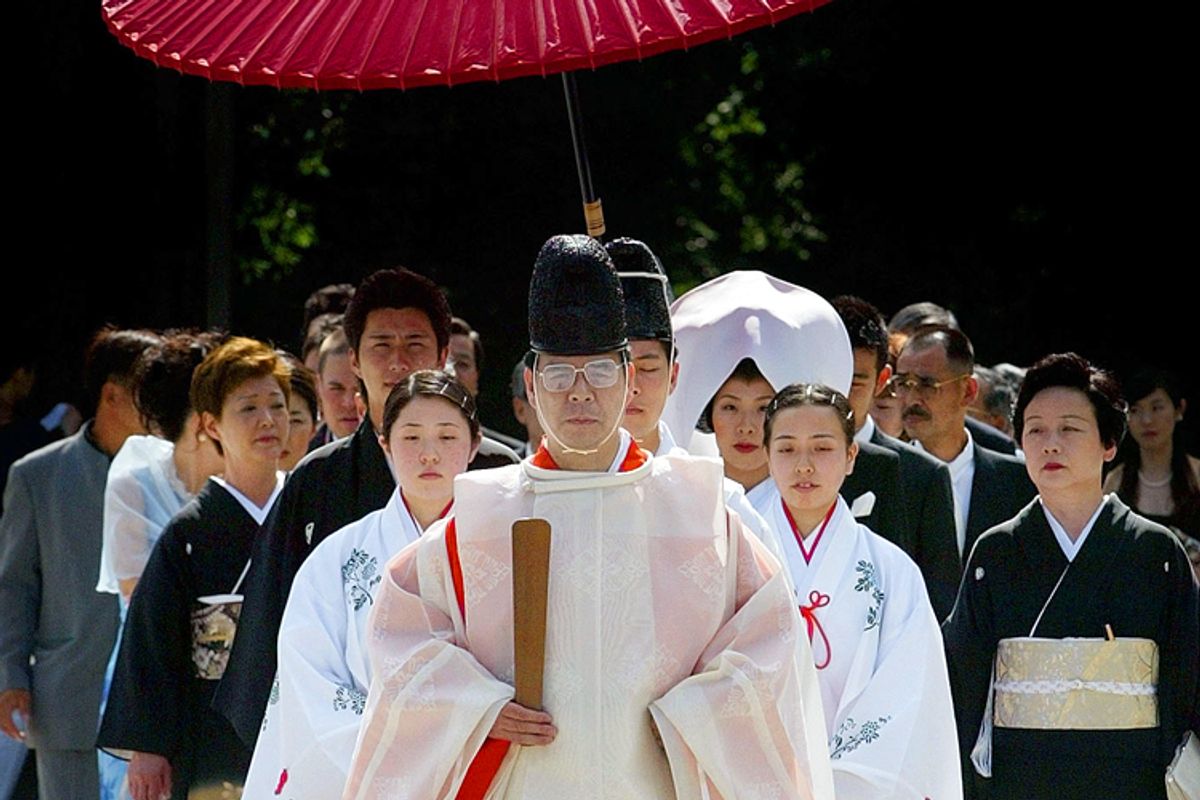 A Shinto priest conducts a wedding at the Meiji shrine in Tokyo.       (AP/Junji Kurokawa)