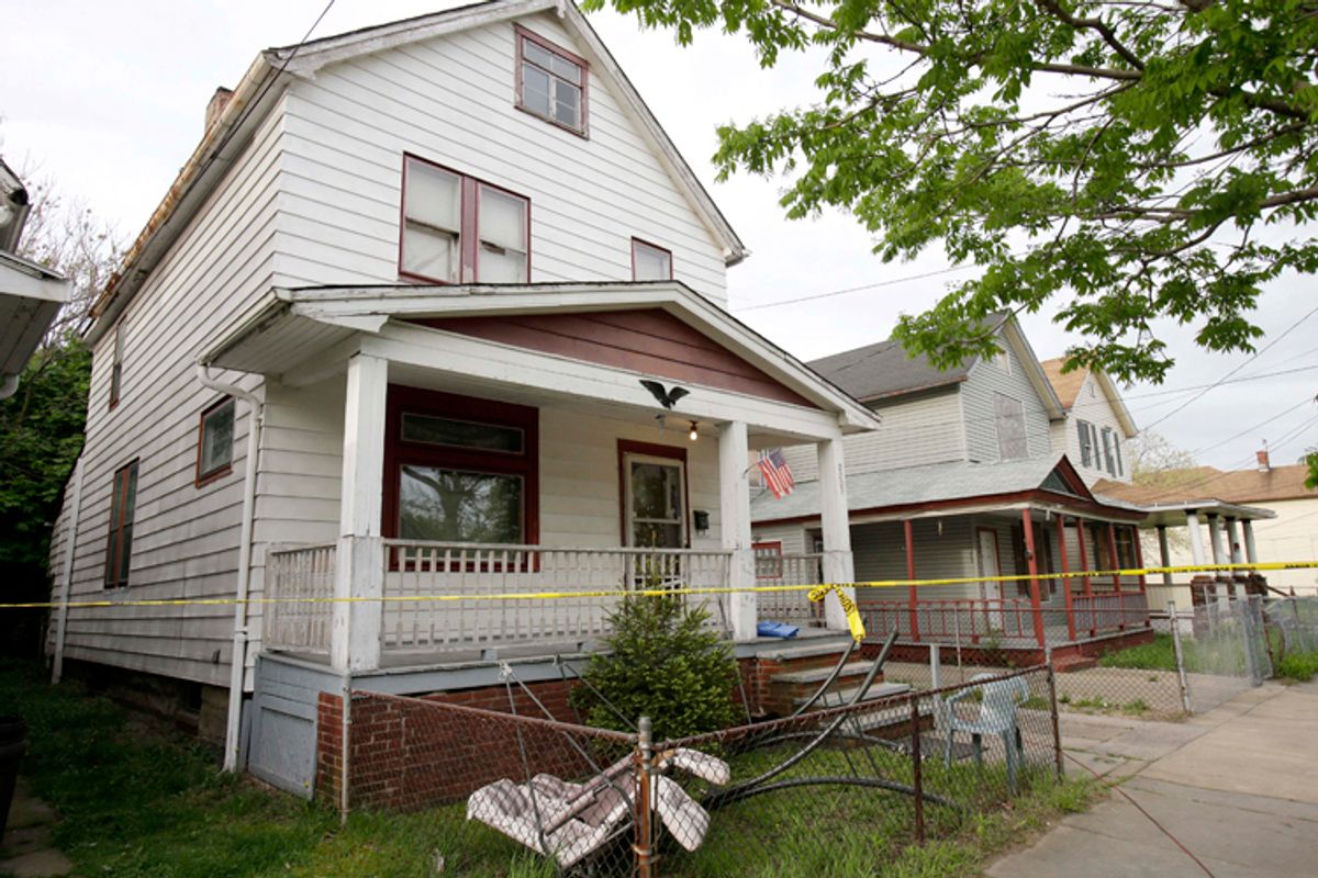 The Cleveland house where Amanda Berry, Gina DeJesus and Michelle Knight were allegedly kept in captivity for nearly a decade.      (AP/Tony Dejak)