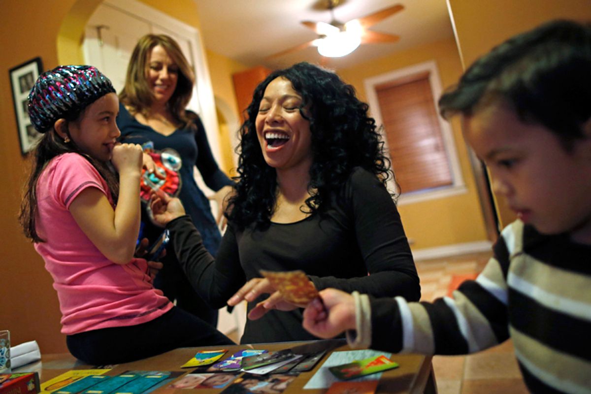 Mercedes Santos and her partner Theresa Volpe, with their children at their home in Chicago, December 22, 2012. (Reuters/Jim Young)