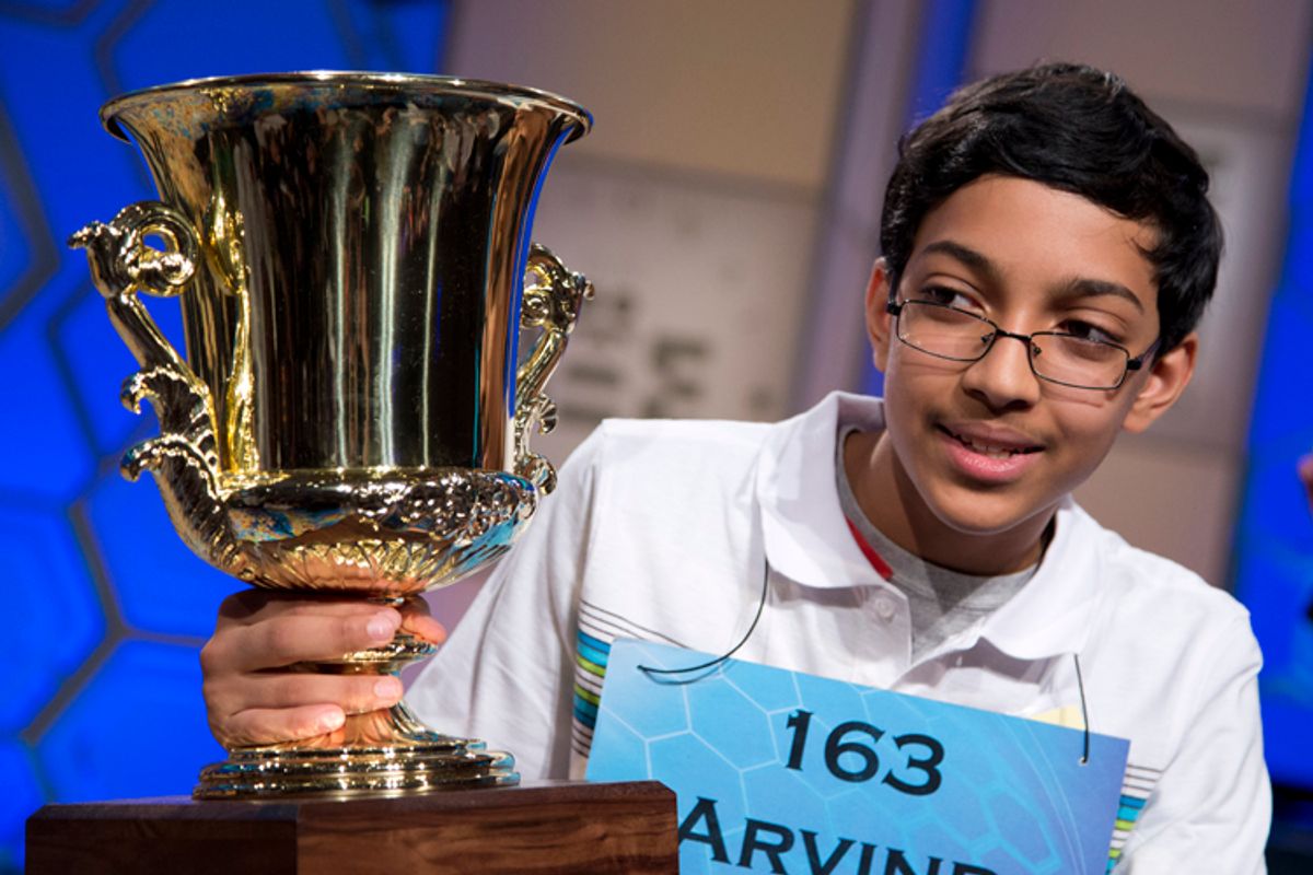 Arvind Mahankali, 13, of Bayside Hills, N.Y., holds the championship trophy after he won the National Spelling Bee by spelling the word "knaidel" correctly on Thursday, May 30, 2013, in Oxon Hill, Md. (AP Photo/Evan Vucci)    (Evan Vucci)