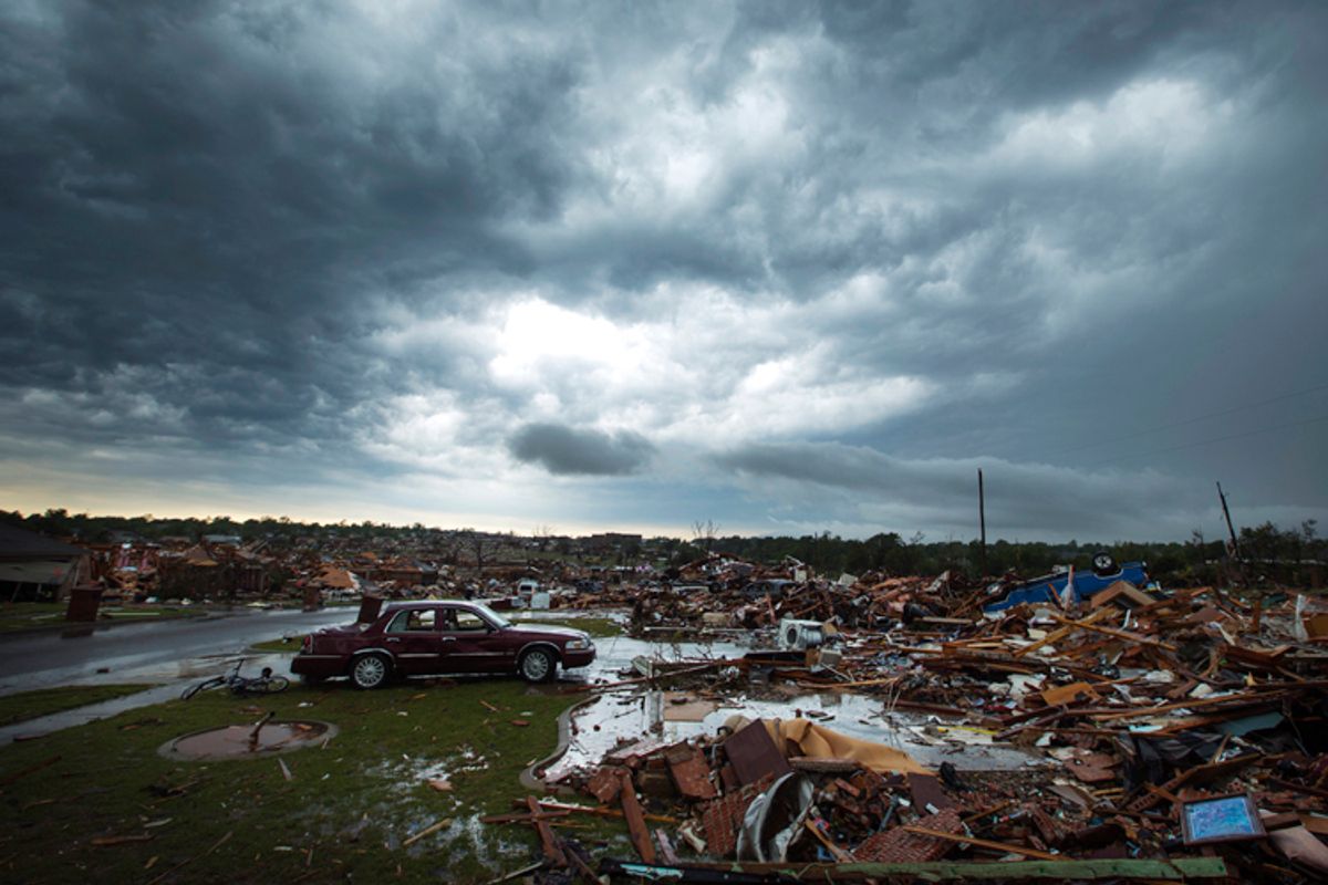 The clouds of a thunderstorm roll over neighborhoods heavily damaged in a tornado in Moore, Oklahoma, May 23, 2013.  (Reuters/Lucas Jackson)