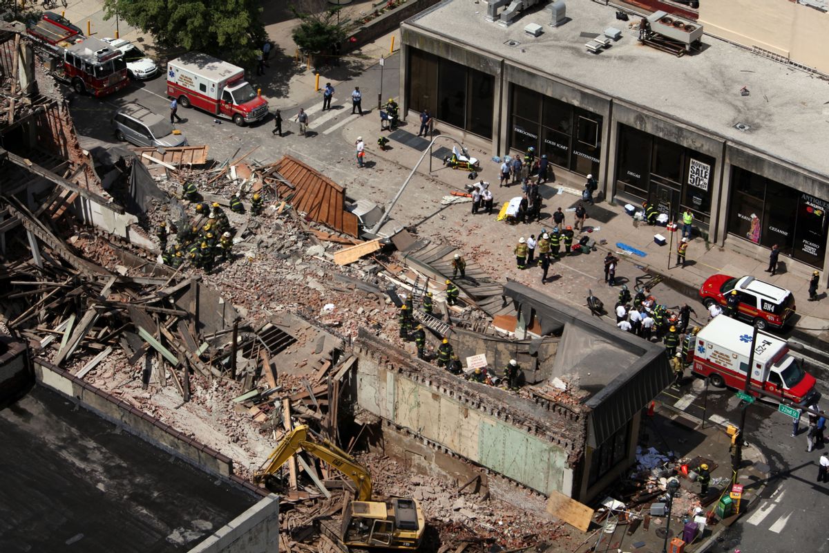 Rescue personnel work the scene of a building collapse in downtown Philadelphia, Wednesday, June 5, 2013.  (AP/Jacqueline Larma)