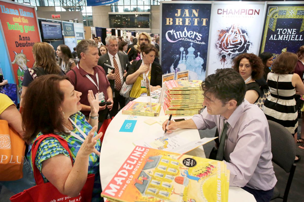 Author John Bemelmans Marciano autographs copies of his book at Book Expo America, May 30, 2013 in New York.   (AP/Mark Lennihan)