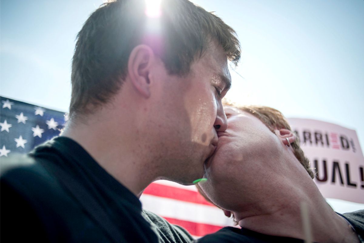 Michael Knaapen (L) and his husband John Becker, both of Wisconsin, react to the 5-4 ruling striking down as unconstitutional the Defense of Marriage Act at the U.S. Supreme Court in Washington June 26, 2013.  (Reuters/James Lawler Duggan)