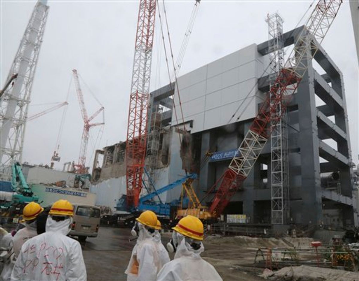 The steel structure for the use of the spent fuel removal from the cooling pool is seen at the Unit 4 of the Fukushima Dai-ichi nuclear plant at Okuma in Fukushima prefecture, Japan, Wednesday, June 12, 2013.   (AP Photo/Noboru Hashimto)