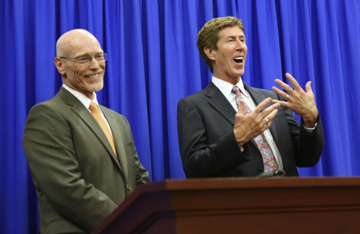 Defense attorneys Don West (L), and Mark O'Mara address the media following George Zimmerman's not guilty verdict     (Reuters)