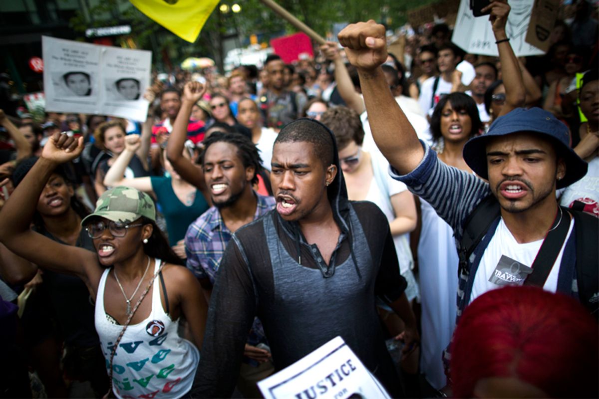 Zimmerman verdict demonstrators march toward Times Square           (AP/John Minchillo)