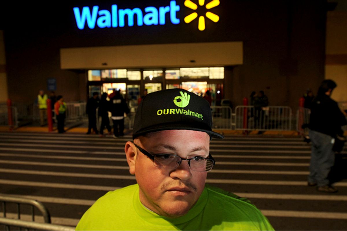 Protester outside a Walmart store                            (Reuters/Noah Berger)