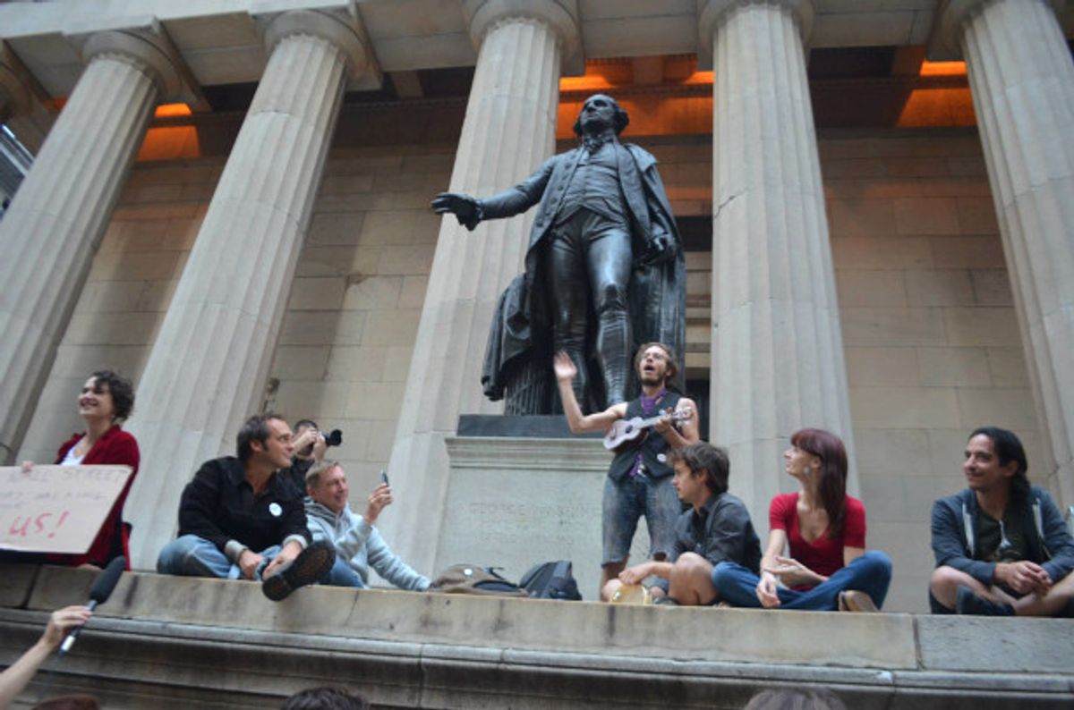  Occupy Wall Street activists at the steps of the Federal Hall Memorial on Wall Street at Sunday’s OWS Participatory Walking Tour. (Stacy Lanyon)