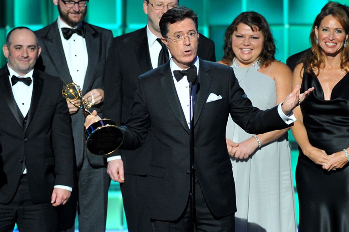 Stephen Colbert, center, and cast and crew of "The Colbert Report"      (AP/Vince Bucci)
