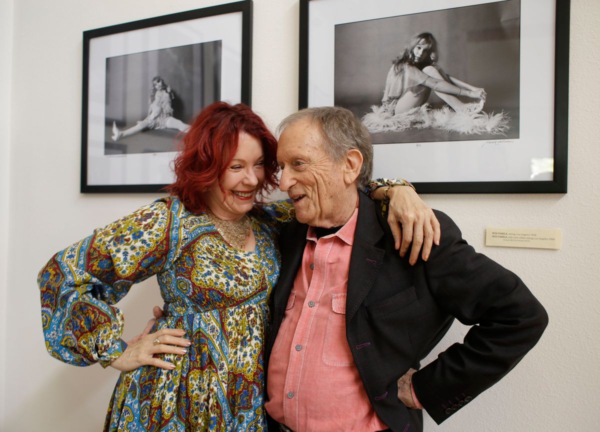 Rolling Stone photographer Baron Wolman, right, embraces Pamela Des Barres.    (AP/Eric Risberg)