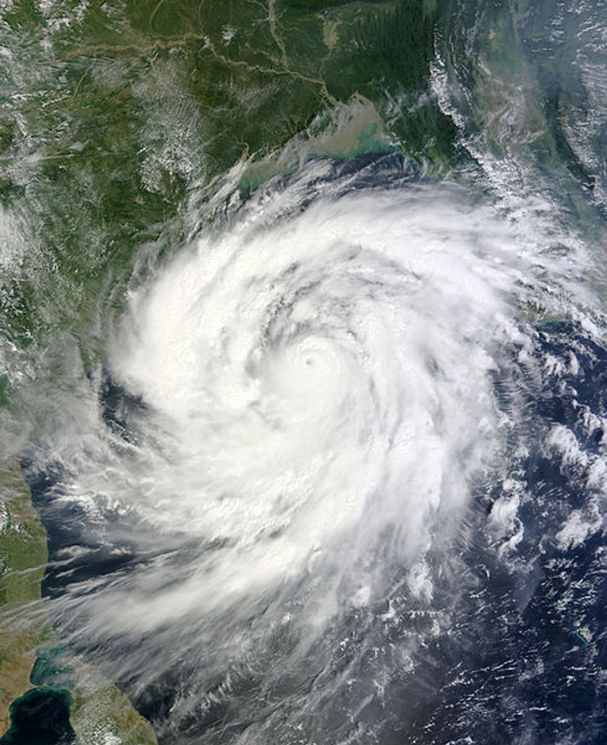 Cyclone Phailin over the Bay of Bengal on 11 October 2013. At the time the image was taken, Phailin was a violent Category 4 equivalent tropical cyclone with 1-min winds peaking at 250 km/h (155 mph) and a central pressure of 940 millibars.  (Wikimedia Commons)