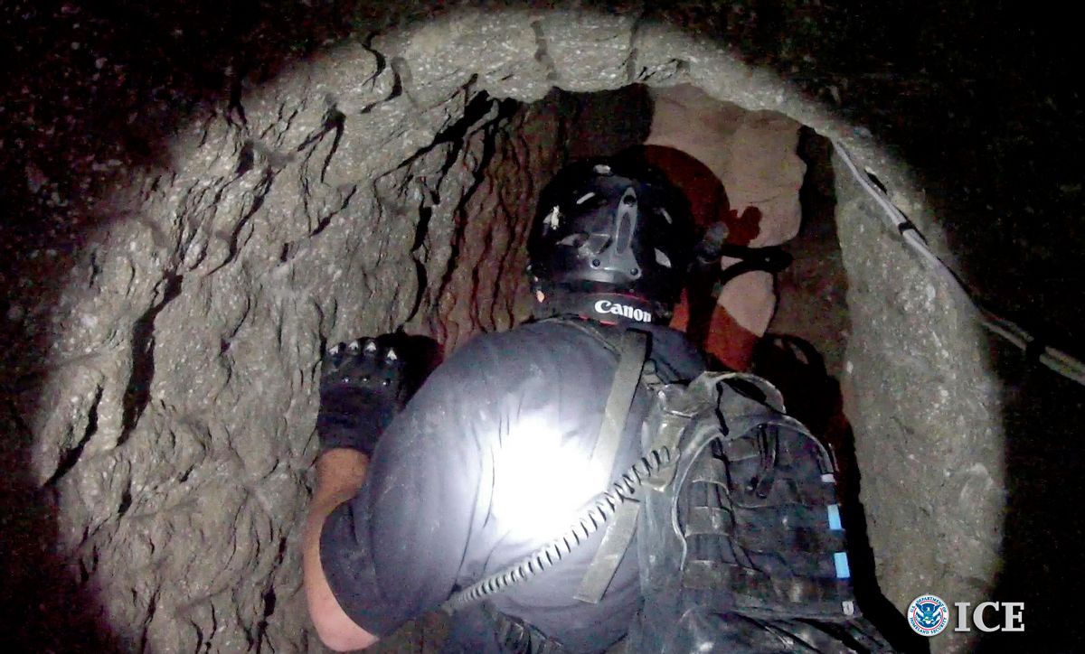 An Oct. 31, 2013, photo released by U.S. Immigration and Customs Enforcement shows agents in a tunnel designed to smuggle drugs from Tijuana, Mexico, to San Diego.   (AP/U.S. Immigration and Customs Enforcement, Paul Caffrey)